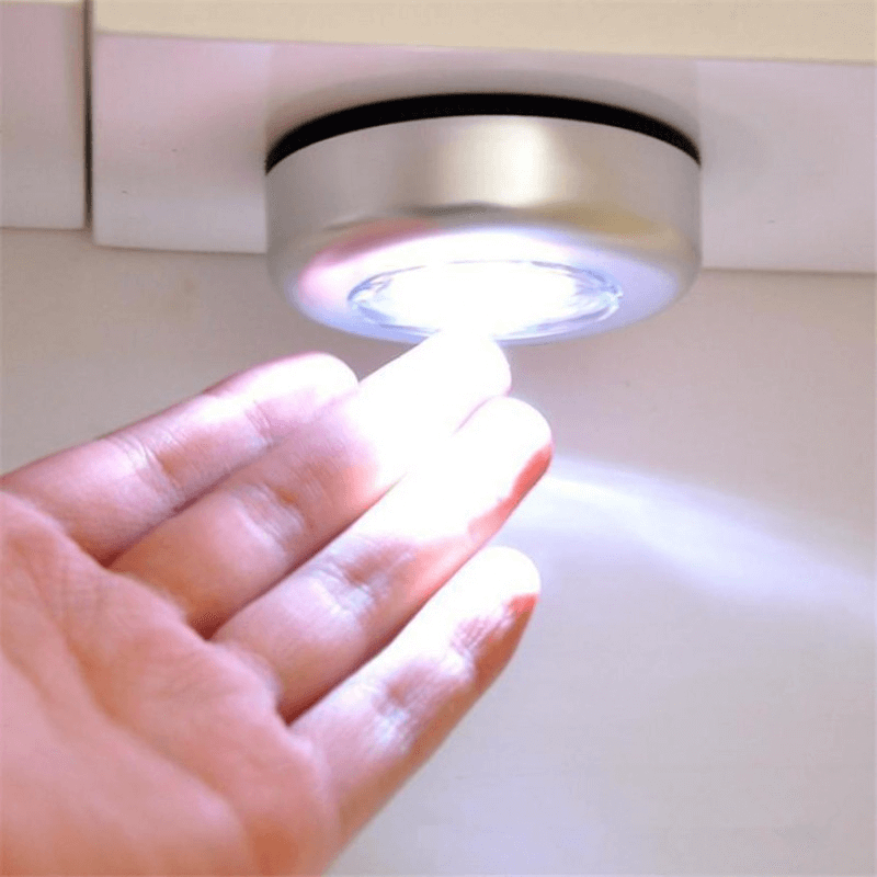 Battery powered LED touch light glowing in wardrobe